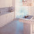 Cozinha revestida em mármore Branco Carrara, polido .